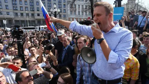AFP Alexei Navalny addresses supporters at an anti-Putin rally in Moscow