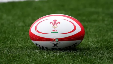 Catherine Ivill/Getty Rugby ball bearing the WRU logo