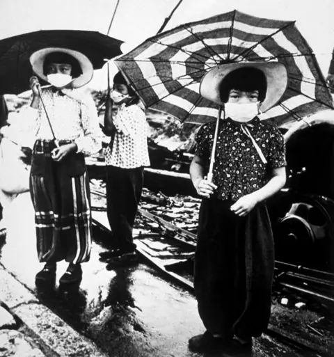 Getty Images Children wear masks