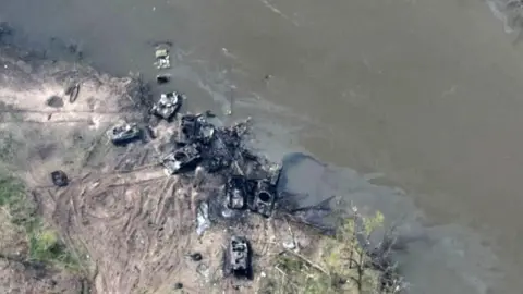 Ukrainian Airborne Forces Command An image allegedly showing burnt out Russian tanks on the Siverskiy Donets river. Photo: May 2022