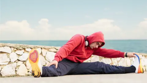 Getty Images man doing the splits