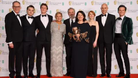 Getty Images The cast and team behind 1917 with their Bafta for best British film