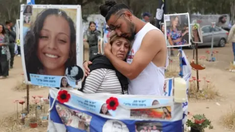EPA Family members of victims visit the memorial site for the music festival in southern Israel attacked by Hamas