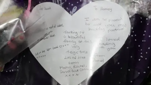 Arron Chown/PA Floral tribute