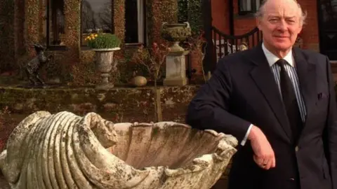 Pacemaker Barney Eastwood in front of house