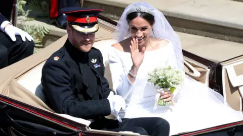 PA Prince Harry and Meghan Markle leave St George's Chapel in Windsor Castle after their wedding