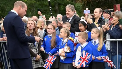 PA Media Prince William with pupils from Howard Junior School in King's Lynn