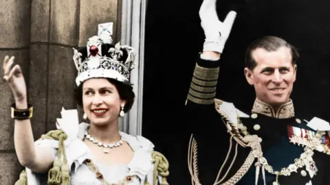 Print Collector/Getty Queen Elizabeth II and the Duke of Edinburgh on the day of their coronation, Buckingham Palace, 1953. (Colorised black and white print). Artist Unknown. (Photo by The Print Collector/Getty Images)