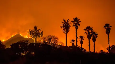 AFP The Thomas Fire burns along a hillside near Santa Paula, California, on December 5, 2017.