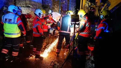 EAAA/Chris Taylor Emergency services freeing Jonathan Willis