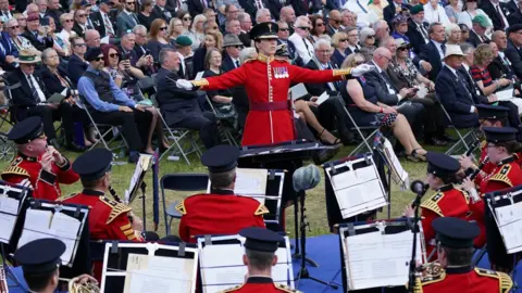 PA Media A military band performs at a service to mark the 40th anniversary of the liberation of the Falkland Islands at the National Memorial Arboretum in Alrewas, Staffordshire.