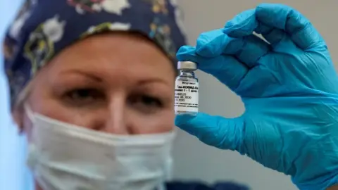 Reuters Nurse holding the Russian Sputnik V vaccine