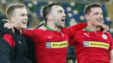 Cliftonville players celebrates after their semi-final victory