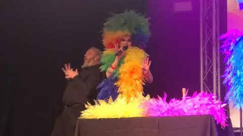 Drag performer and BSL interpreter