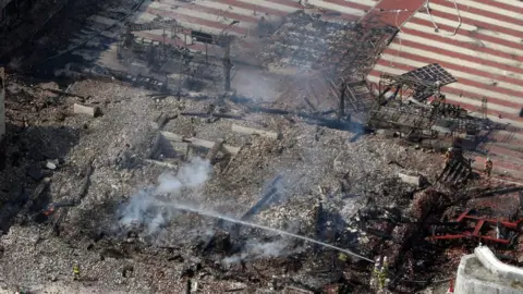 EPA An aerial photograph shows the destroyed Shuri Castle in Naha