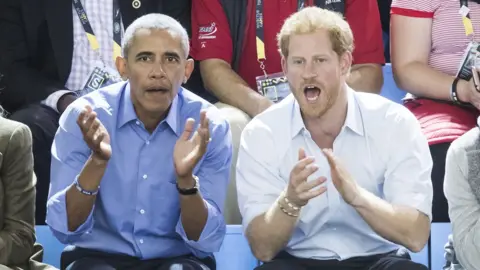 PA Barack Obama and Prince Harry