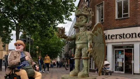 Wakefield Council/LDRS The sculpture with artist Jason Wilsher-Mills