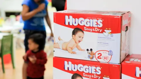 Getty Images A general view of the atmosphere while Giuliana Rancic donates toys from Duke's 1st birthday party and helps distribute 1,000,000 Huggies Snug & Dry Diapers at the Baby2Baby warehouse on August 21, 2013 in Los Angeles, California.