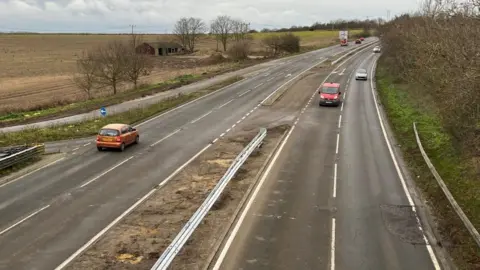 ANDREW TURNER/BBC The crash barrier installation work completed on the A149 Caister Bypass.