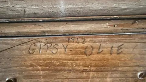 National Trust '1942 Gipsy - Olie' scratched above a fireplace