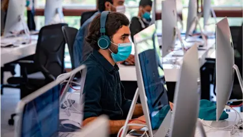 Getty Images A student uses a computer at a lab room at the "1337" information technology training centre in Morocco.