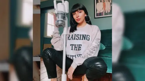 Carrie-Anne Roberts Carrie-Anne Roberts in a Raising the Future jumper