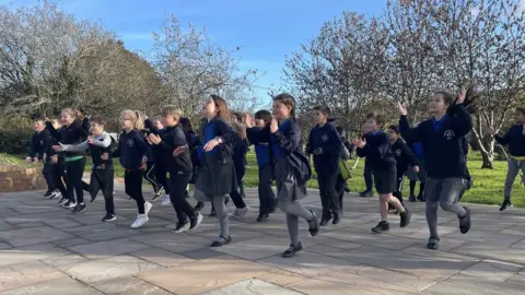 Practicing for the advent service at St Joseph's Catholic Primary School, Penarth