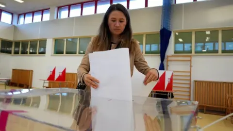 Reuters A voter in Warsaw