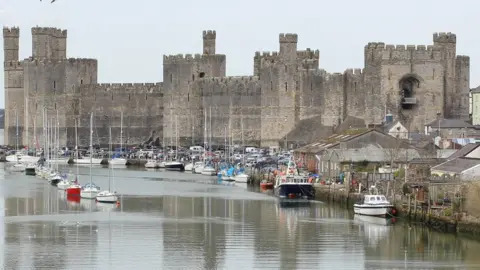 Greg Mape The imposing Caernarfon Castle protecting the Menai Strait was captured during an Easter weekend stroll by Greg Mape