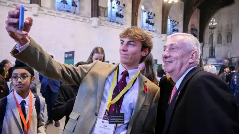 Reuters Sir Lindsay posed for selfies with UK Youth Parliament members
