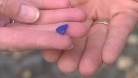 Hands holding sea glass