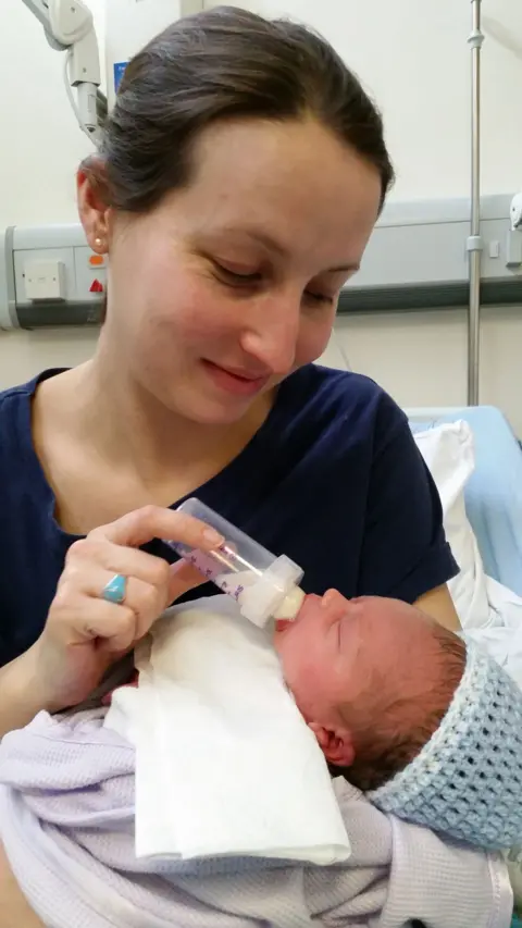 Ellie Finch Hulme feeding her son Charlie