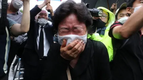 Getty Images A mourner at the funeral on Monday