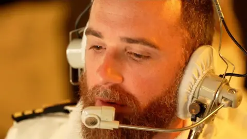 BBC/Maarten Lernout Cdr Peter Evans, Commanding Officer, HMS Diamond