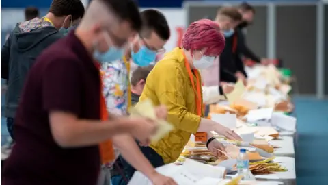 Matthew Horwood / Getty Images Ballot papers are counted for the Senedd election at the Cardiff House of Sport