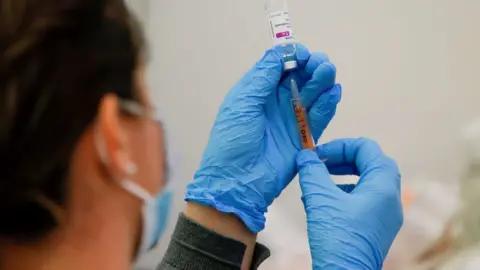 Reuters A Covid-19 vaccine dose being prepared