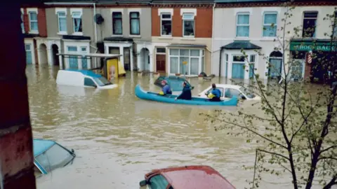 Betty Adams Canoe on a flooded street