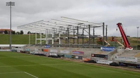 Getty Images The East stand being built in 2014, with a crane visible to the right of the stand