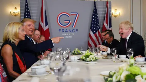 Getty Images Trump and Johnson share laughs at the 2019 summit in France