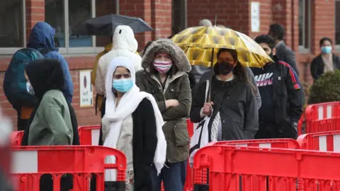 PA Media People queuing for a vaccination at the Glasgow Central Mosque in Glasgow
