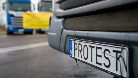 BBC/Matthew Goddard A registration plate with the words protest