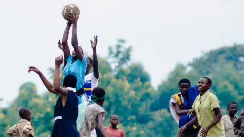 Neil Thomas/Corbis/Getty Girls play netball in Uganda