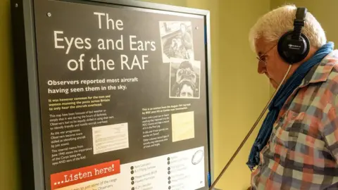 Bury St Edmunds Guildhall A man listens to tales of the RAF in Bury St Edmunds