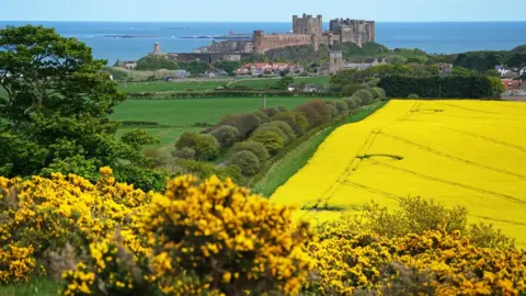 Owen Humphreys/PA Bamburgh Castle in Northumberland