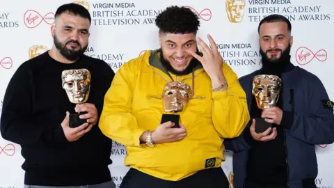 PA Media Tubsey, Big Zuu and Hyder at the Baftas