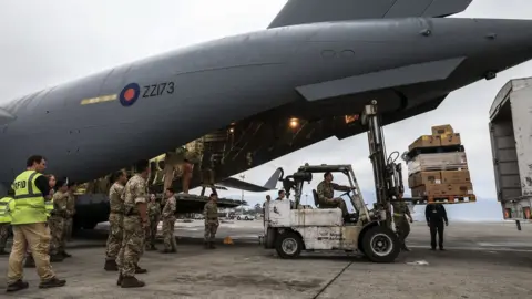 Ministry of Defence UK RAF plane being loaded with aid supplies