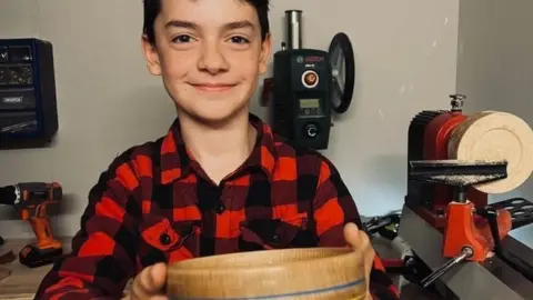 PA Media Gabriel Clark holding his Bowl for Ukraine