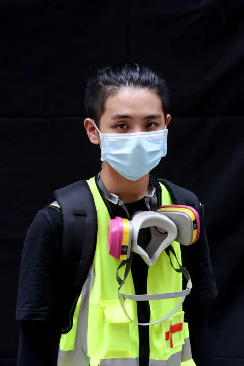 Lauren Crothers A protester poses for a portrait during the Anti-Totalitarianism march in Causeway Bay, Hong Kong, 29 September 2019