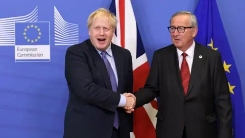 Getty Images Boris Johnson and Jean-Claude Juncker shaking hands