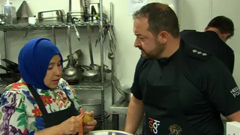 South Wales police runs a cookery competition between officers and local women in Cardiff to build with the community